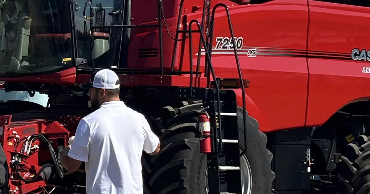 Terry in front of CaseIH combine