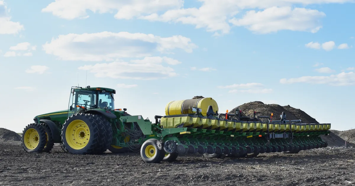 planter in field with MudSmith gauge wheels